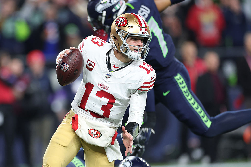 SEATTLE, WASHINGTON - JANUARY 17: Brock Purdy #13 of the San Francisco 49ers scrambles during the third quarter against the Seattle Seahawks in the NFC Divisional Playoff game at Lumen Field on January 17, 2026 in Seattle, Washington. (Photo by Sean M. Haffey/Getty Images)