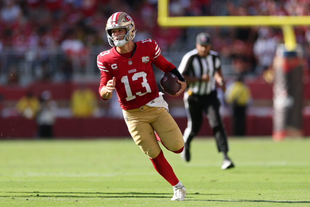 SANTA CLARA, CALIFORNIA - SEPTEMBER 27: Brock Purdy #13 of the San Francisco 49ers runs with the ball during the fourth quarter against the Arizona Cardinals at Levi's Stadium on September 27, 2026 in Santa Clara, California. (Photo by Ezra Shaw/Getty Images)
