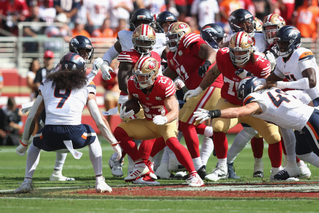 SANTA CLARA, CALIFORNIA - OCTOBER 04: Christian McCaffrey #23 of the San Francisco 49ers runs the ball for a first down in the second quarter against the Denver Broncos at Levi's Stadium on October 04, 2026 in Santa Clara, California. (Photo by Lachlan Cunningham/Getty Images)