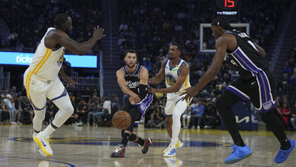 SAN FRANCISCO, CALIFORNIA - OCTOBER 10: Zach LaVine #8 of the Sacramento Kings passes the ball to Precious Achiuwa #9 while defended by De'Anthony Melton #8 of the Golden State Warriors during the first half of the preseason game at Chase Center on October 10, 2026 in San Francisco, California. NOTE TO USER: User expressly acknowledges and agrees that, by downloading and or using this photograph, User is consenting to the terms and conditions of the Getty Images License Agreement. (Photo by Godofredo A. Vásquez/Getty Images)