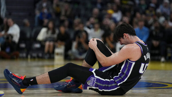 SAN FRANCISCO, CALIFORNIA - OCTOBER 10: Maxime Raynaud #42 of the Sacramento Kings grabs his knee after an injury during the first half of the preseason game against the Golden State Warriors at Chase Center on October 10, 2026 in San Francisco, California. NOTE TO USER: User expressly acknowledges and agrees that, by downloading and or using this photograph, User is consenting to the terms and conditions of the Getty Images License Agreement. (Photo by Godofredo A. Vásquez/Getty Images)