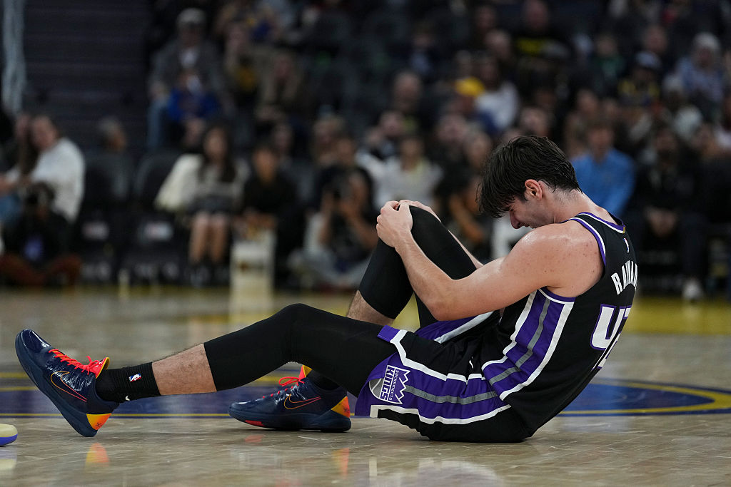 SAN FRANCISCO, CALIFORNIA - OCTOBER 10: Maxime Raynaud #42 of the Sacramento Kings grabs his knee after an injury during the first half of the preseason game against the Golden State Warriors at Chase Center on October 10, 2026 in San Francisco, California. NOTE TO USER: User expressly acknowledges and agrees that, by downloading and or using this photograph, User is consenting to the terms and conditions of the Getty Images License Agreement. (Photo by Godofredo A. Vásquez/Getty Images)
