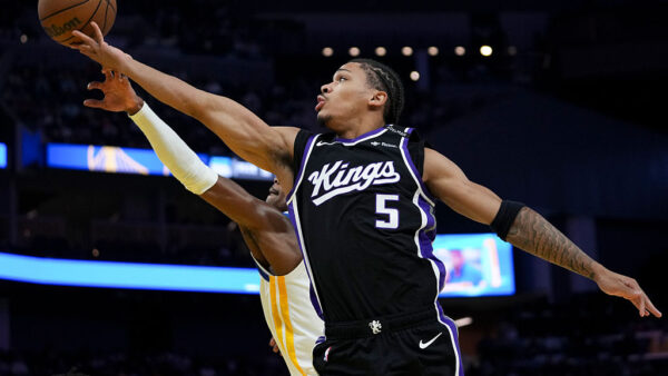 SAN FRANCISCO, CALIFORNIA - OCTOBER 10: Darius Acuff Jr. #5 of the Sacramento Kings shoots the ball while defended by Brandon Williams #12 of the Golden State Warriors during the first half of the preseason game at Chase Center on October 10, 2026 in San Francisco, California. NOTE TO USER: User expressly acknowledges and agrees that, by downloading and or using this photograph, User is consenting to the terms and conditions of the Getty Images License Agreement. (Photo by Godofredo A. Vásquez/Getty Images)