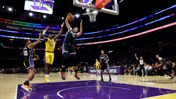 LOS ANGELES, CALIFORNIA - OCTOBER 08: Maxime Raynaud #42 of the Sacramento Kings rebounds against Kevon Looney #55 of the Los Angeles Lakers during the second quarter in a preseason game at Crypto.com Arena on October 08, 2026 in Los Angeles, California. NOTE TO USER: User expressly acknowledges and agrees that, by downloading and or using this photograph, user is consenting to the terms and conditions of the Getty Images License Agreement. (Photo by Luke Hales/Getty Images)