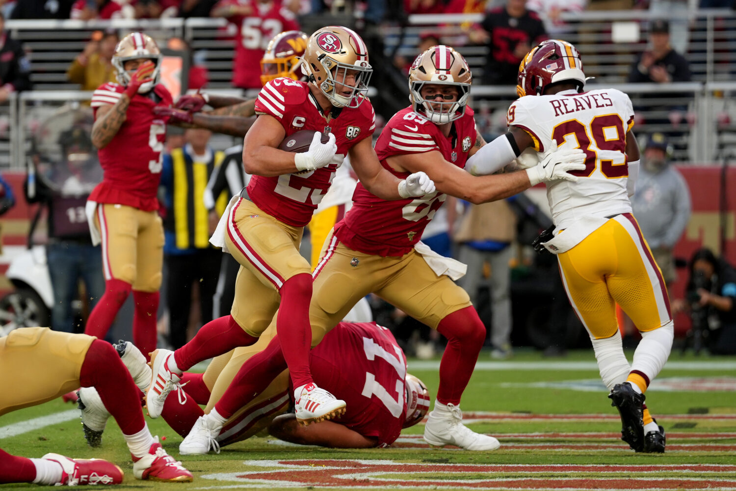 SANTA CLARA, CALIFORNIA - OCTOBER 19: Christian McCaffrey #23 of the San Francisco 49ers scores a t...