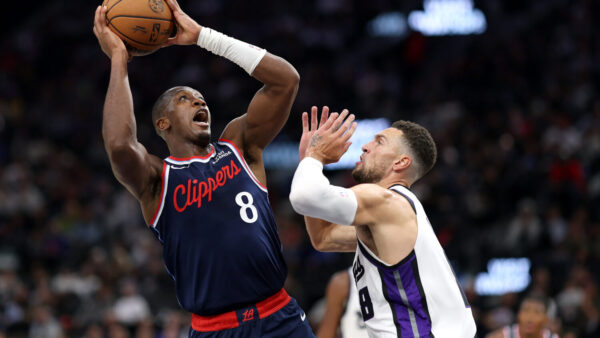 INGLEWOOD, CALIFORNIA - OCTOBER 21: Kris Dunn #8 of the Los Angeles Clippers shoots the ball against Zach LaVine #8 of the Sacramento Kings during the second quarter at Intuit Dome on October 21, 2026 in Inglewood, California. NOTE TO USER: User expressly acknowledges and agrees that, by downloading and or using this photograph, user is consenting to the terms and conditions of the Getty Images License Agreement. (Photo by Luke Hales/Getty Images)