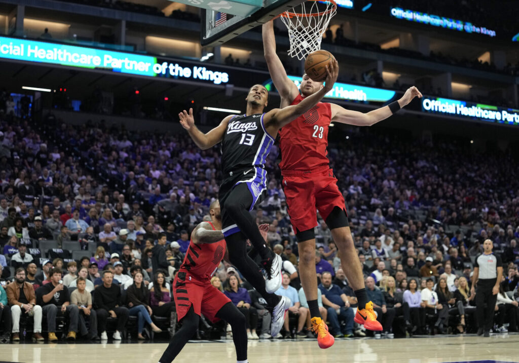 SACRAMENTO, CALIFORNIA - OCTOBER 23: Keegan Murray #13 of the Sacramento Kings shoots and scores over Donovan Clingan #23 of the Portland Trail Blazers in the first half of their game at Golden 1 Center on October 23, 2026 in Sacramento, California. NOTE TO USER: User expressly acknowledges and agrees that, by downloading and or using this photograph, User is consenting to the terms and conditions of the Getty Images License Agreement. (Photo by Thearon W. Henderson/Getty Images)