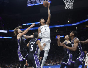 SAN ANTONIO, TX -OCTOBER 27: Victor Wembanyama #1 of the San Antonio Spurs grabs a rebound over a host of Sacramento Kings players in the first half at Frost Bank Center on October 27, 2026 in San Antonio, Texas. NOTE TO USER: User expressly acknowledges and agrees that, by downloading and or using this photograph, User is consenting to terms and conditions of the Getty Images License Agreement. (Photo by Ronald Cortes/Getty Images)