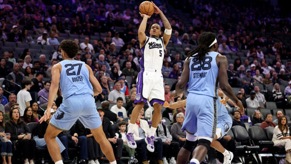 SACRAMENTO, CALIFORNIA - OCTOBER 25: Darius Acuff Jr. #5 of the Sacramento Kings shoots over Cameron Boozer #27 of the Memphis Grizzlies during the first quarter at Golden 1 Center on October 25, 2026 in Sacramento, California. NOTE TO USER: User expressly acknowledges and agrees that, by downloading and/or using this photograph, user is consenting to the terms and conditions of the Getty Images License Agreement. (Photo by Ezra Shaw/Getty Images)